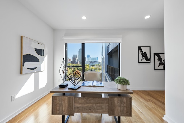 office with light hardwood / wood-style flooring