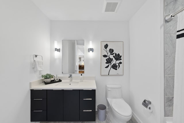 bathroom with vanity and toilet