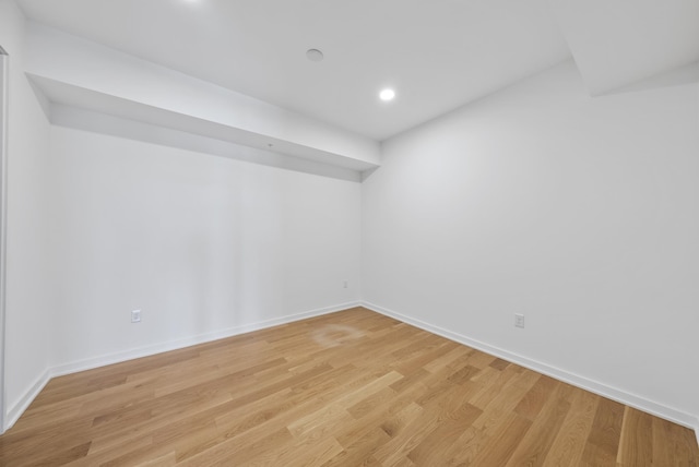 empty room with light hardwood / wood-style flooring