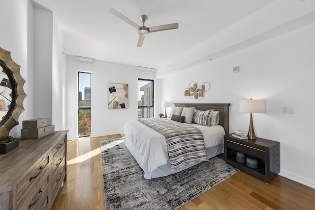 bedroom featuring hardwood / wood-style flooring and ceiling fan