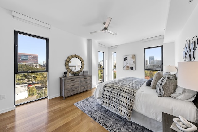 bedroom featuring light hardwood / wood-style flooring and ceiling fan