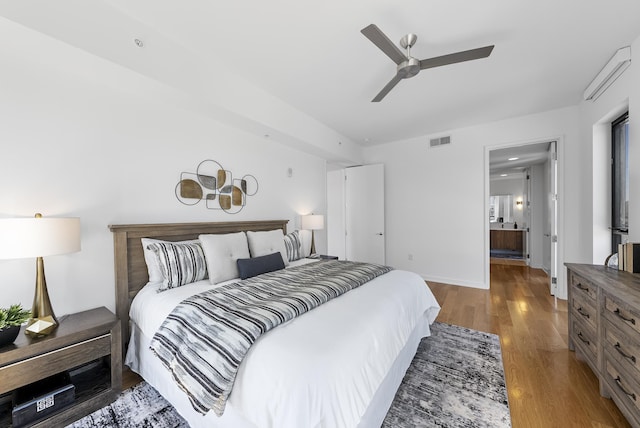 bedroom with hardwood / wood-style flooring and ceiling fan