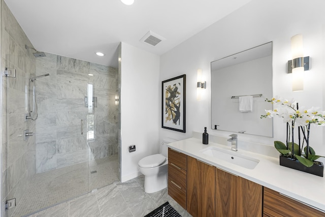 bathroom with vanity, walk in shower, and toilet