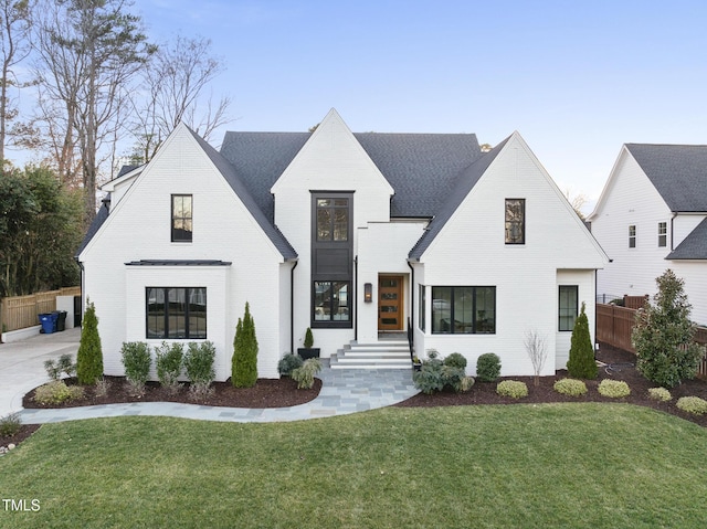 modern farmhouse featuring a front yard