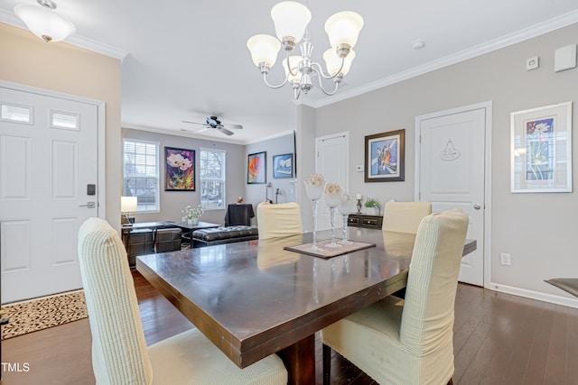 dining space with ornamental molding, dark wood-style flooring, baseboards, and ceiling fan with notable chandelier