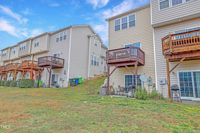 back of property featuring a lawn