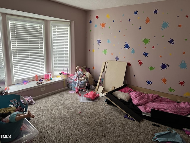 carpeted bedroom featuring a textured ceiling