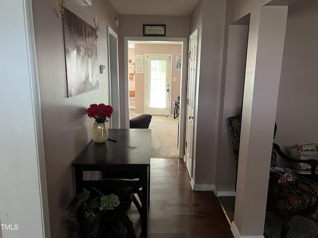 corridor with dark wood-type flooring