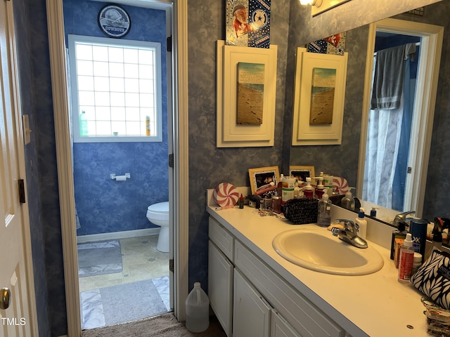 bathroom with vanity and toilet