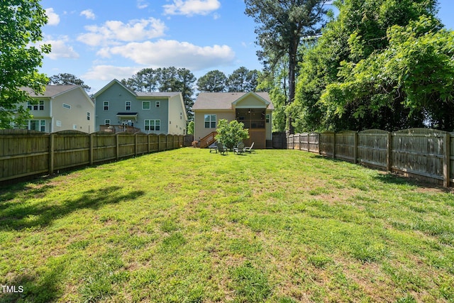 view of yard with a fenced backyard