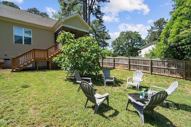 view of yard featuring stairs and fence