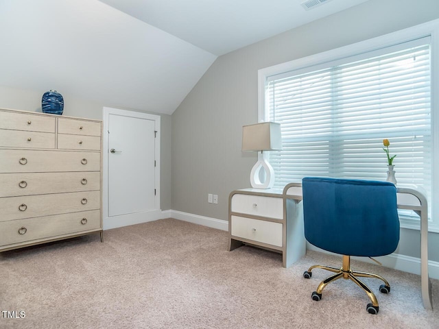 carpeted office with lofted ceiling, visible vents, and baseboards