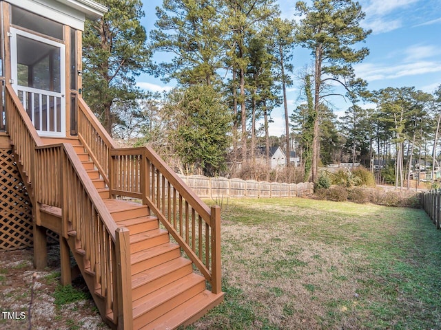 view of yard with stairs and a fenced backyard