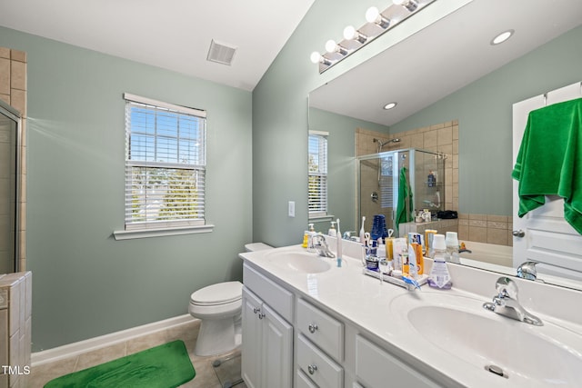 bathroom with a stall shower, tile patterned flooring, visible vents, and a sink