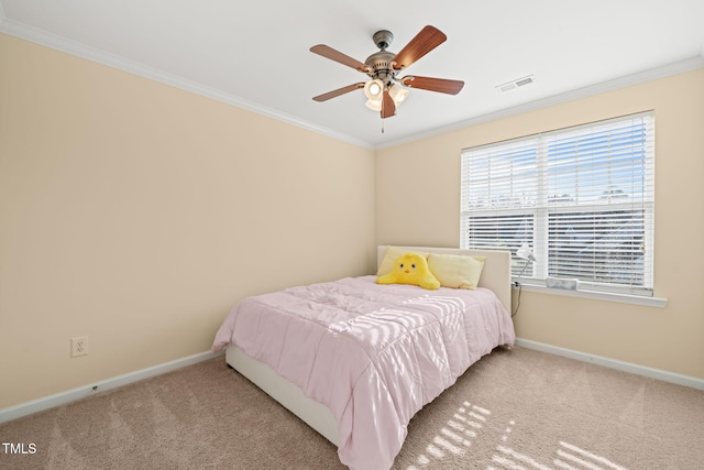 bedroom featuring baseboards, carpet, visible vents, and crown molding