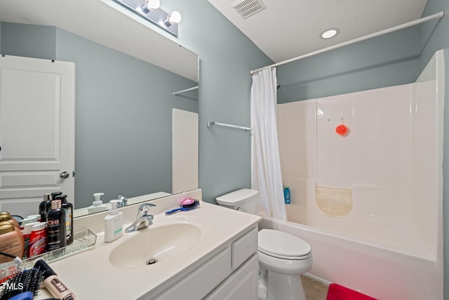 full bath featuring visible vents, vanity, toilet, and shower / bath combo with shower curtain