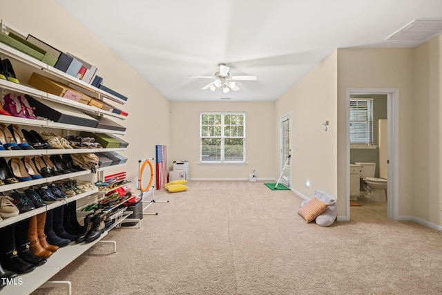 game room with carpet flooring, a ceiling fan, and baseboards