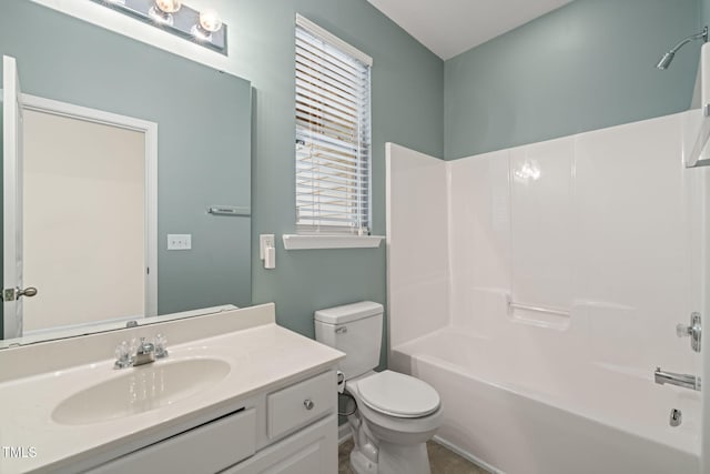 full bathroom with shower / bathing tub combination, vanity, and toilet