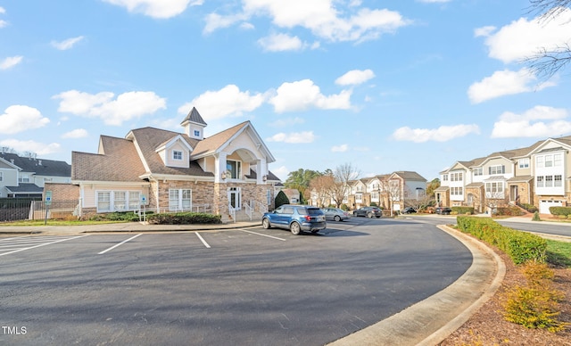 view of road featuring curbs and a residential view