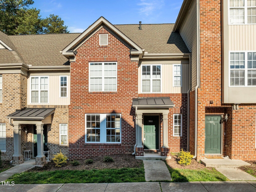 9911 Grettle Ct, Raleigh, NC 27617 - multi unit property with roof with shingles and brick siding