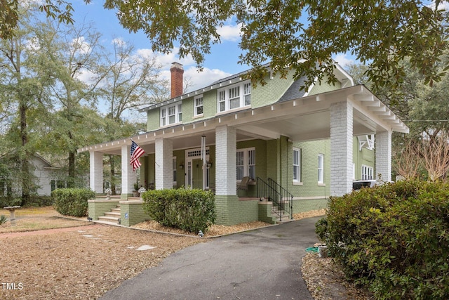 view of front of home featuring a porch and central air condition unit