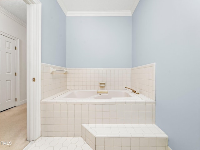 bathroom with a garden tub, ornamental molding, and a textured ceiling