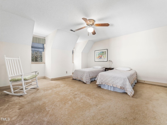 bedroom with baseboards, visible vents, light carpet, and a textured ceiling