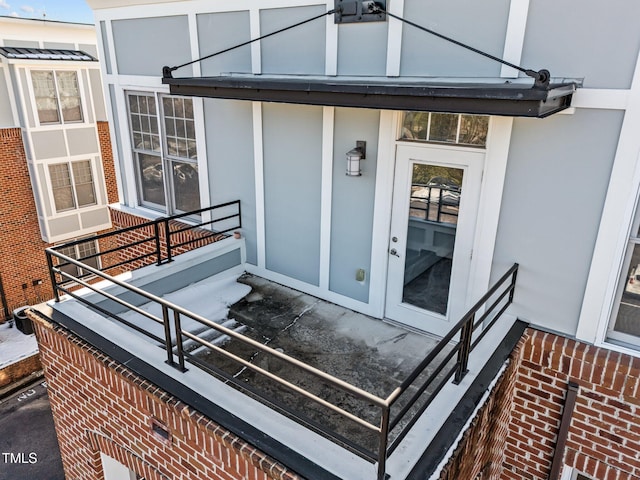 property entrance with brick siding