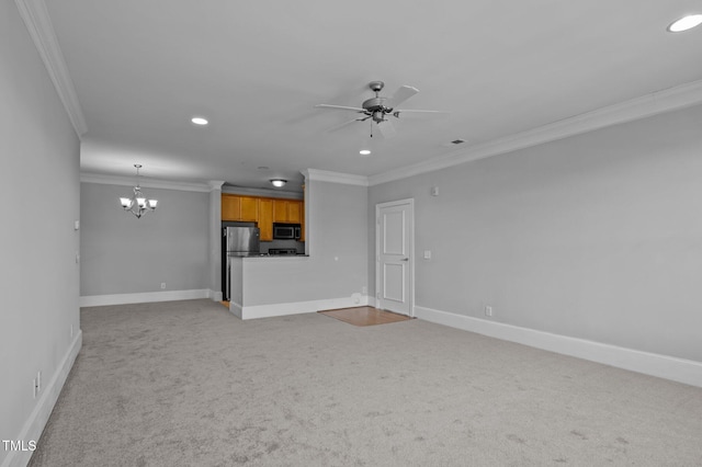 unfurnished living room with carpet, ornamental molding, baseboards, and ceiling fan with notable chandelier