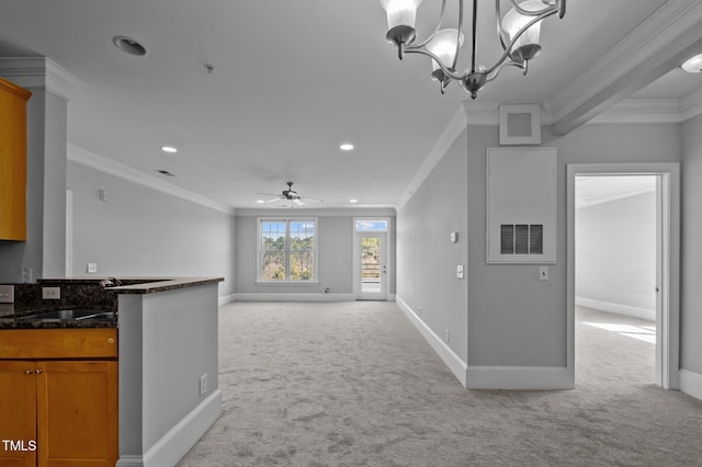 unfurnished living room with light carpet, recessed lighting, baseboards, and crown molding