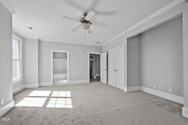 unfurnished bedroom featuring light carpet, baseboards, visible vents, and ornamental molding