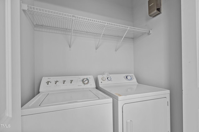 washroom with laundry area and separate washer and dryer