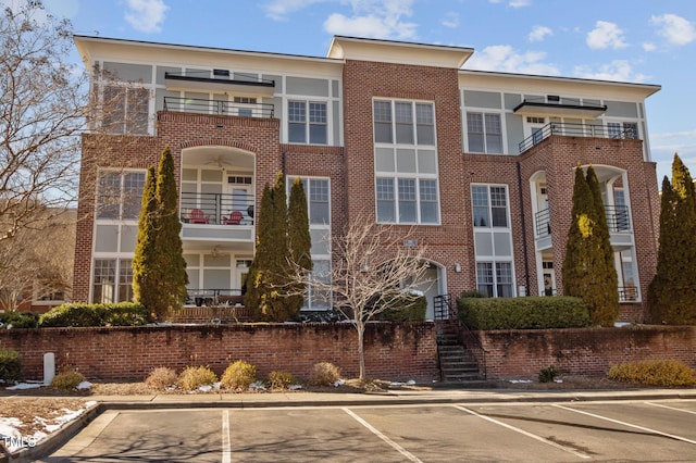 view of property with uncovered parking