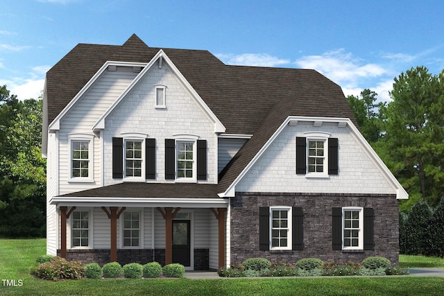 view of front of property featuring covered porch and a front lawn