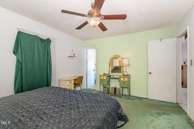 bedroom with carpet, ceiling fan, and a textured ceiling