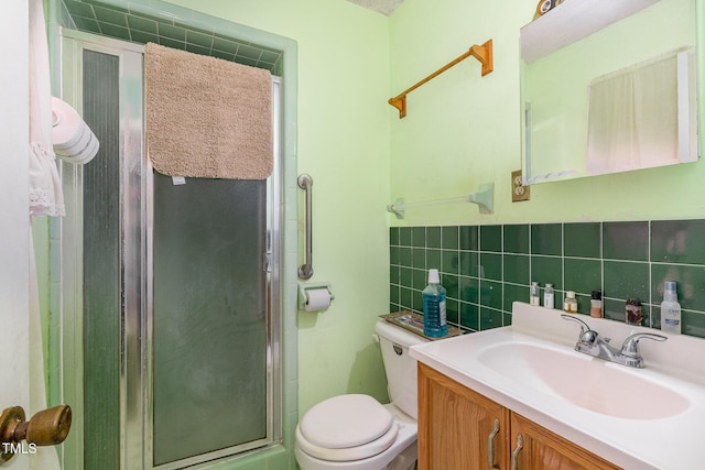 full bath featuring toilet, vanity, tile walls, tasteful backsplash, and a stall shower