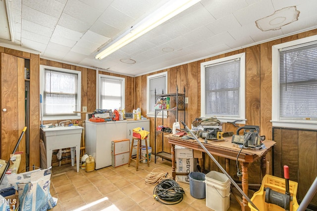 office space with washer / dryer and wooden walls