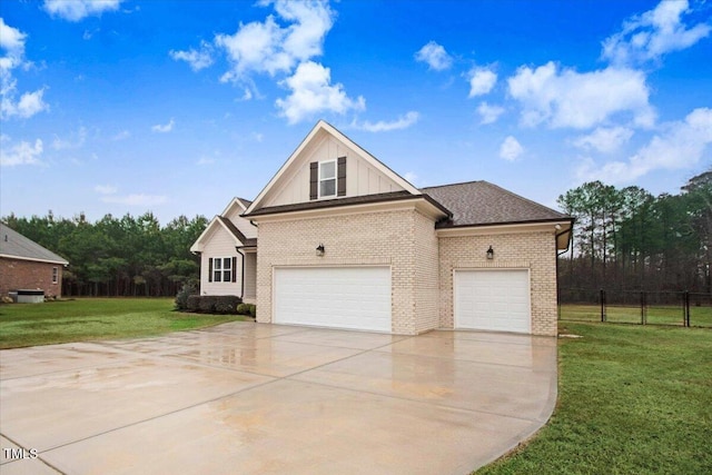 view of front of property featuring a garage and a front yard