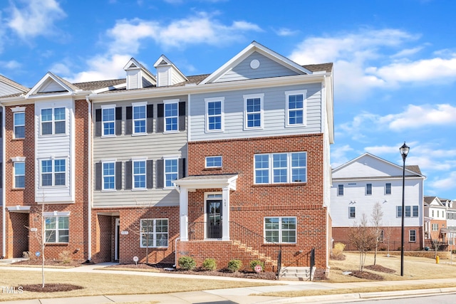 multi unit property featuring brick siding