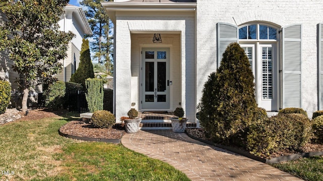 entrance to property featuring stucco siding