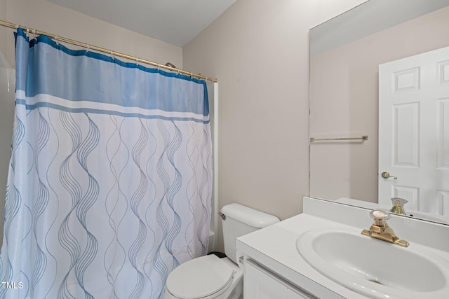 full bathroom with a shower with curtain, vanity, and toilet