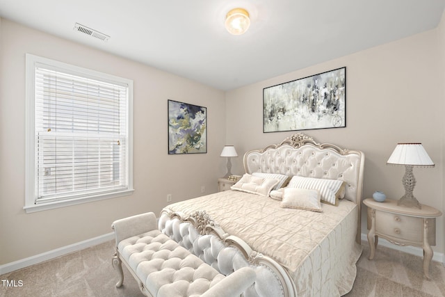 bedroom featuring carpet, visible vents, and baseboards