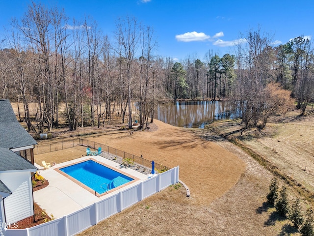 view of swimming pool featuring a fenced in pool, a patio area, a water view, and a fenced backyard