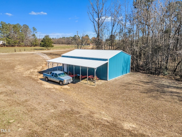 view of outdoor structure with a detached carport