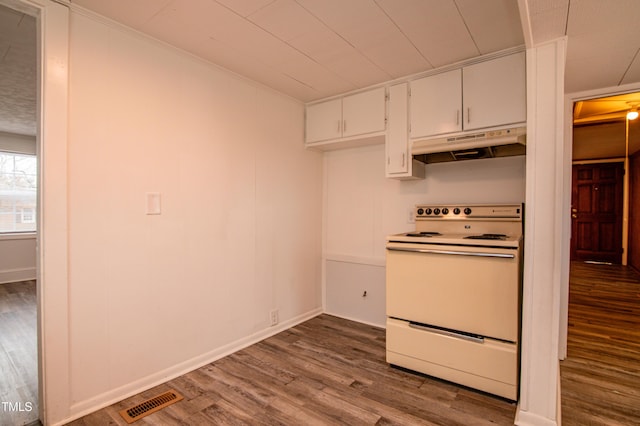 kitchen featuring white cabinetry, white electric range, and hardwood / wood-style flooring