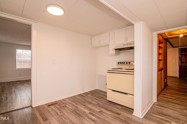 kitchen with white electric range, light wood-type flooring, and white cabinets