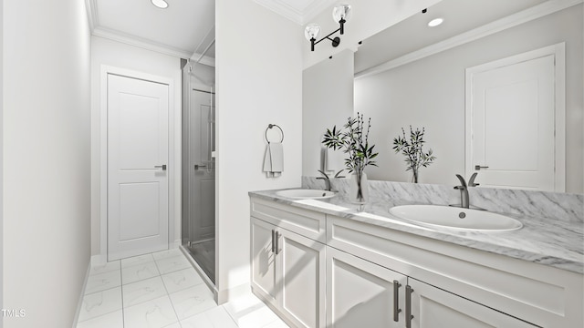 bathroom with vanity, crown molding, and a shower with shower door