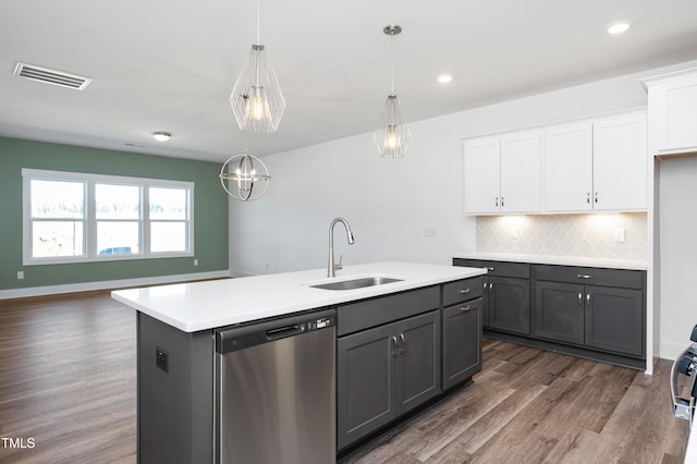 kitchen with sink, white cabinets, hanging light fixtures, a kitchen island with sink, and stainless steel dishwasher