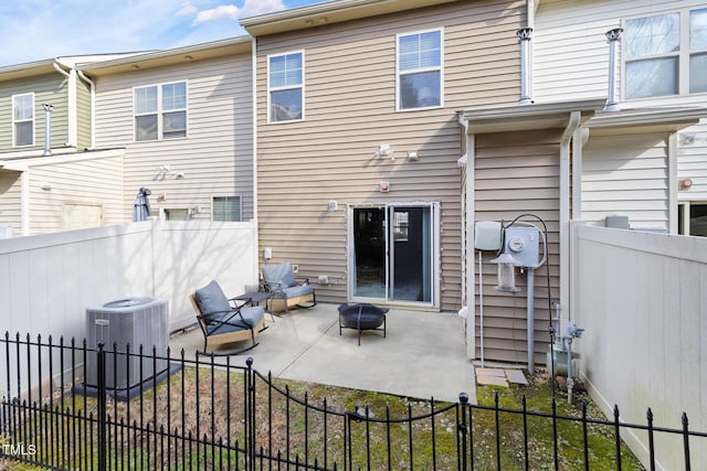 back of property with a patio and cooling unit