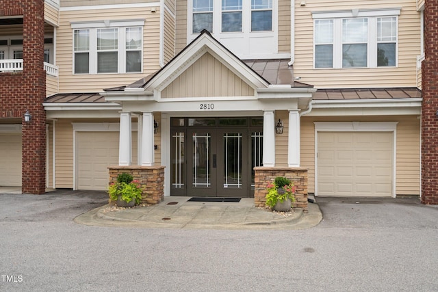 property entrance featuring french doors and a garage